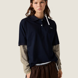 Navy shirt worn by a person, showing the shirt fit