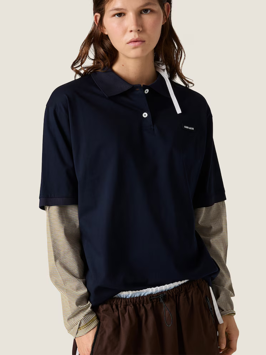 Navy shirt worn by a person, showing the shirt fit