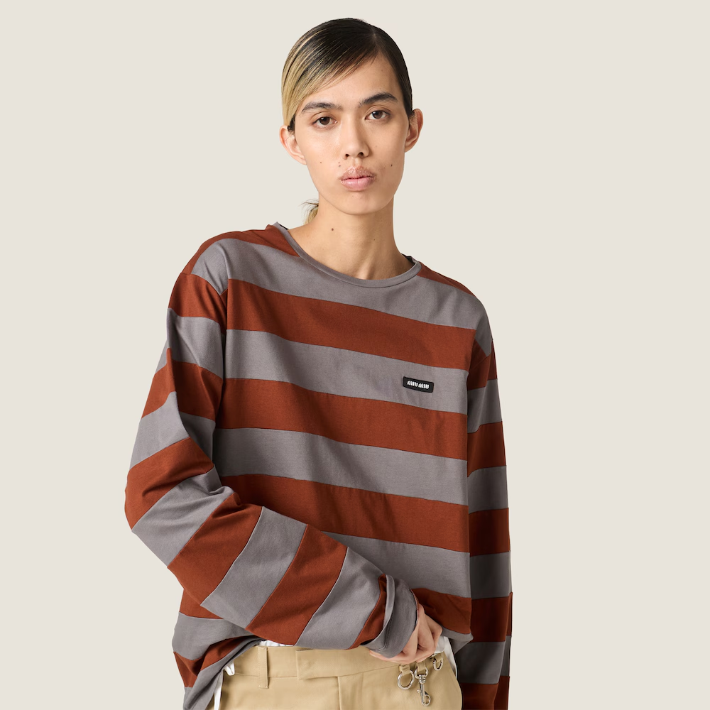 Grey t-shirt worn by a person, showing the t-shirt fit