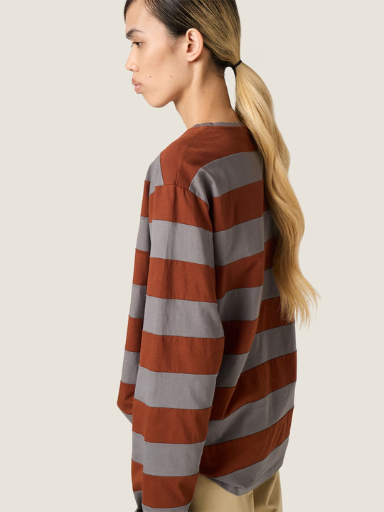 Grey t-shirt worn by a person, showing the t-shirt fit