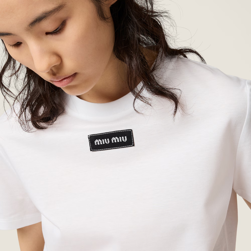 White shirt worn by a person, showing the shirt fit