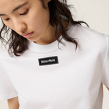 White shirt worn by a person, showing the shirt fit