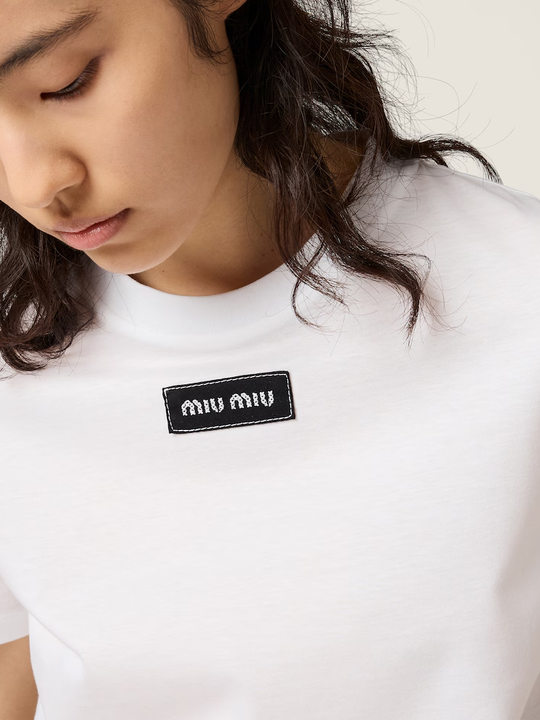White shirt worn by a person, showing the shirt fit