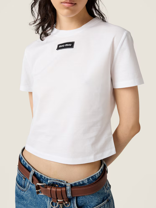 White shirt worn by a person, showing the shirt fit