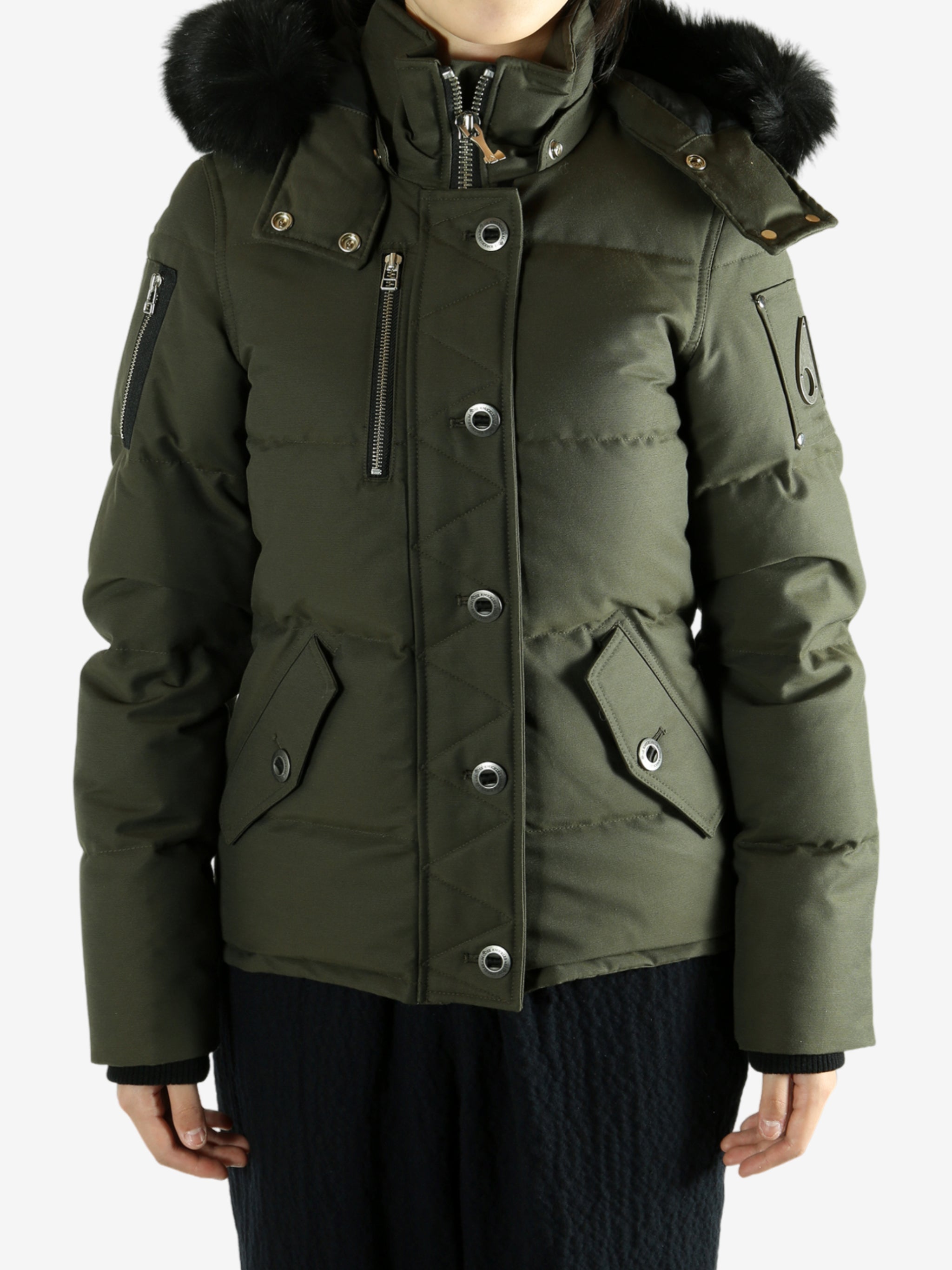 Green jackets worn by a person, showing the jackets fit