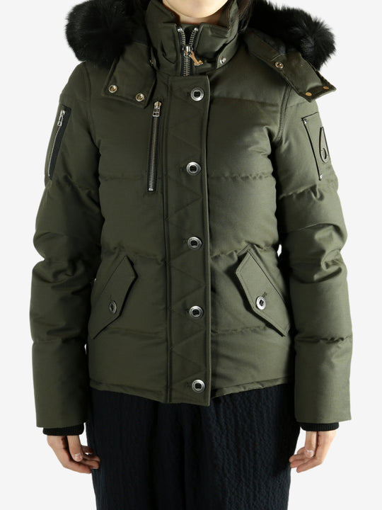 Green jackets worn by a person, showing the jackets fit