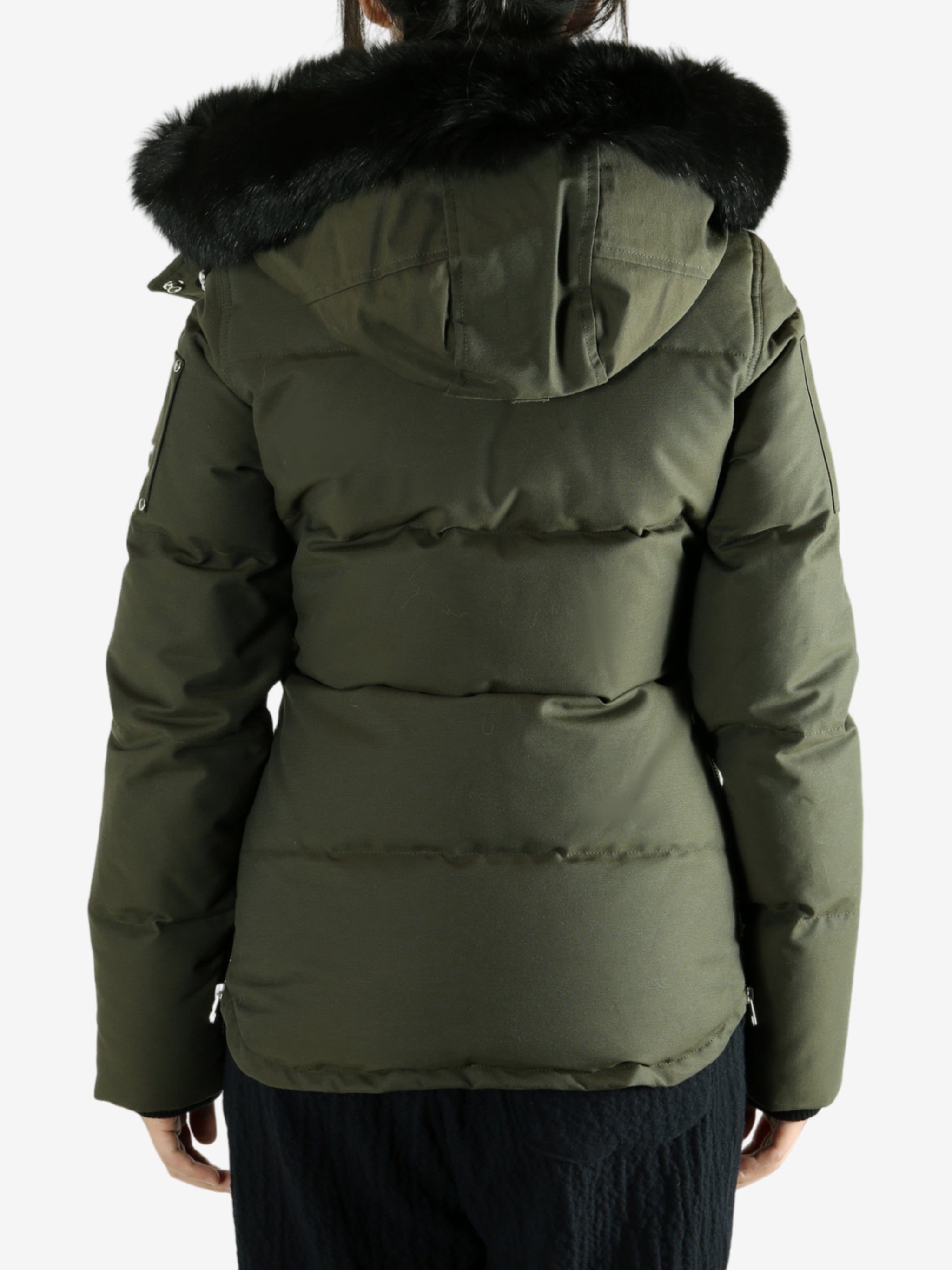 Green jackets worn by a person, showing the jackets fit