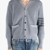 Grey cardigan worn by a person, showing the cardigan fit