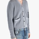 Grey cardigan worn by a person, showing the cardigan fit