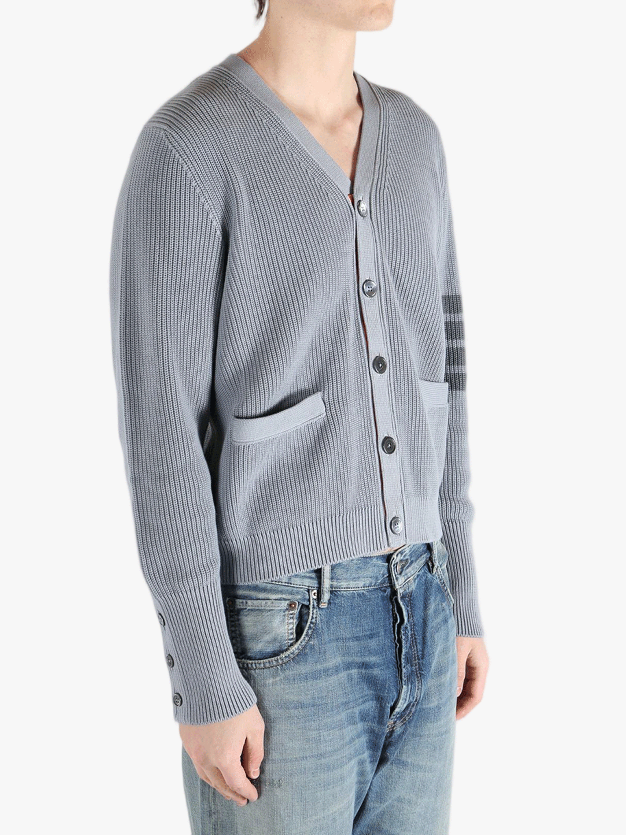 Grey cardigan worn by a person, showing the cardigan fit