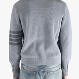 Grey cardigan worn by a person, showing the cardigan fit
