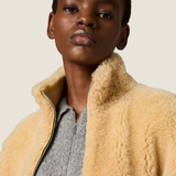 Grey knitwear worn by a person, showing the knitwear fit