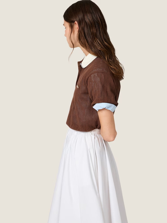 Brown shirt worn by a person, showing the shirt fit