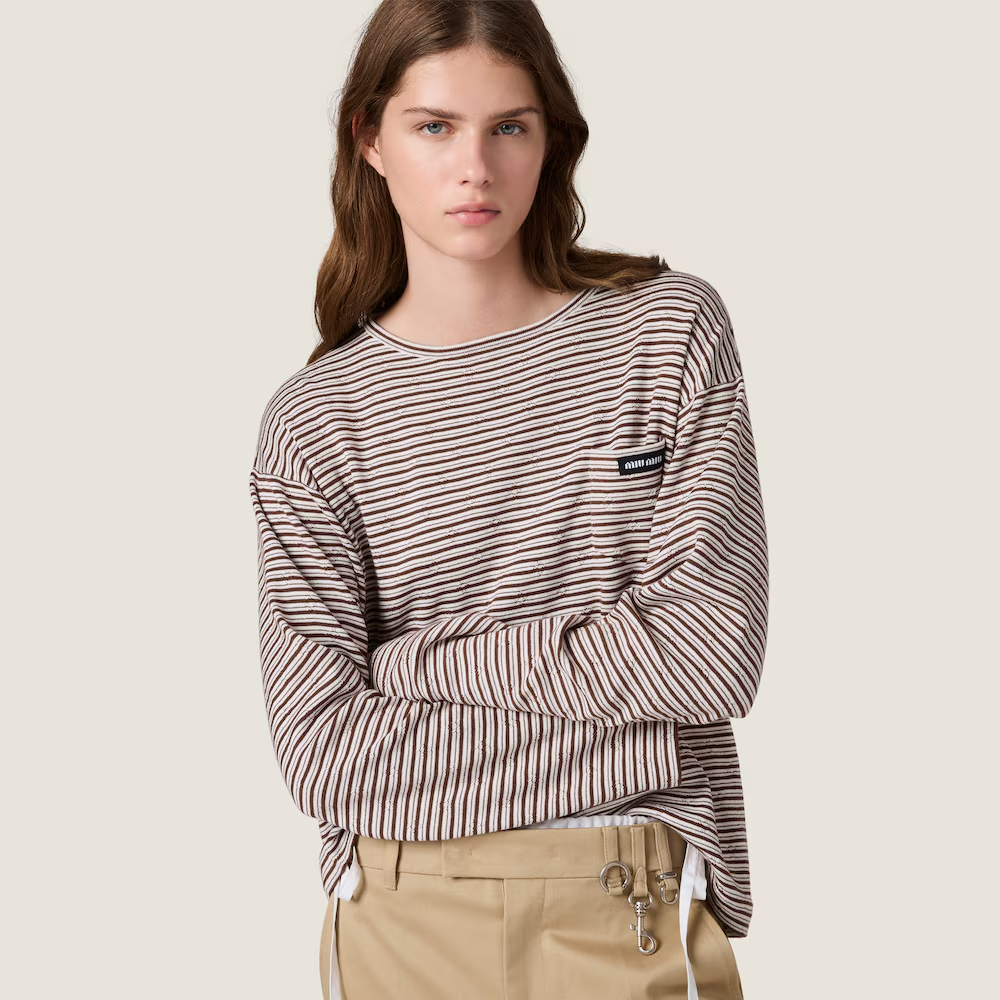 Brown knitwear worn by a person, showing the knitwear fit