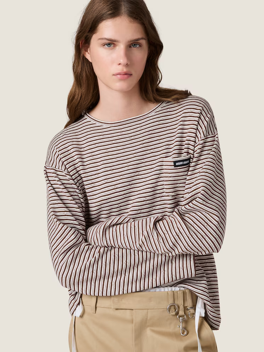 Brown knitwear worn by a person, showing the knitwear fit