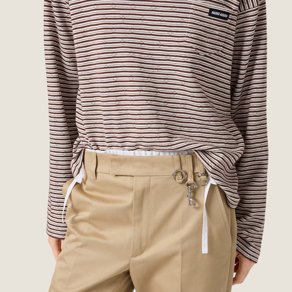 Brown knitwear worn by a person, showing the knitwear fit