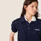 Navy shirt worn by a person, showing the shirt fit