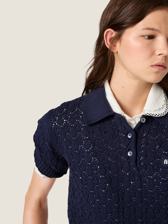 Navy shirt worn by a person, showing the shirt fit