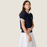 Navy shirt worn by a person, showing the shirt fit