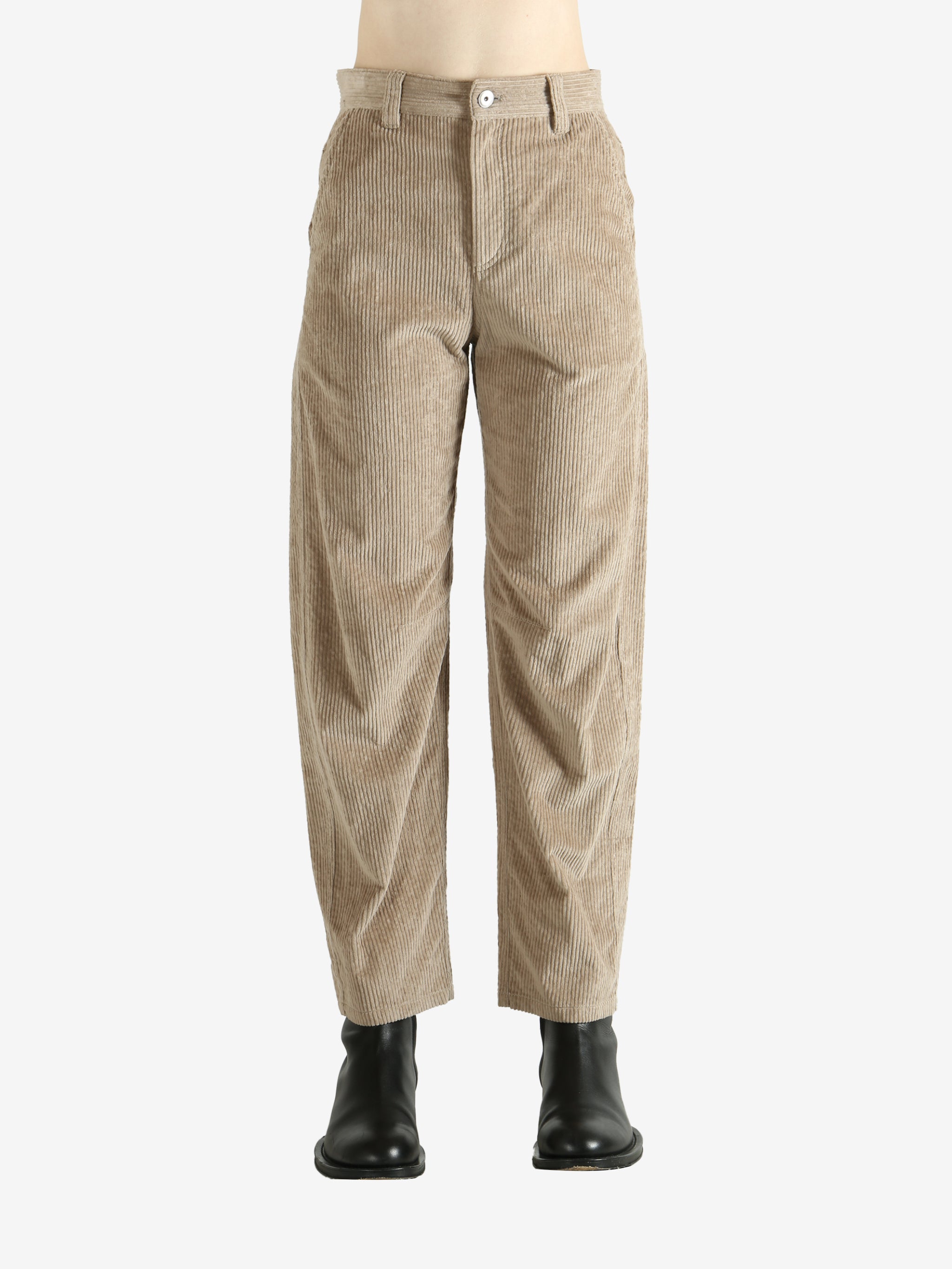 Brown pants worn by a person, showing the pants fit