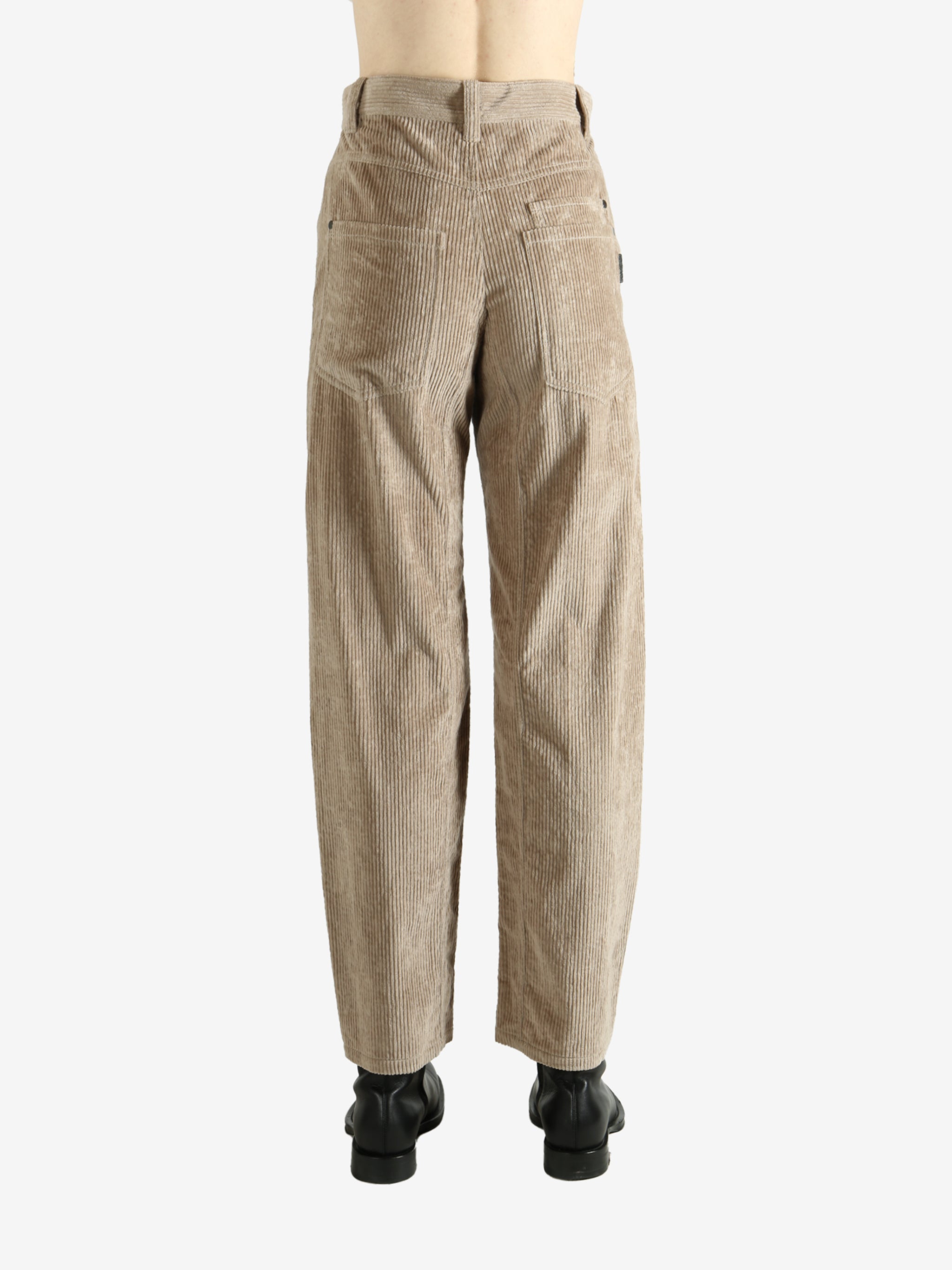 Brown pants worn by a person, showing the pants fit