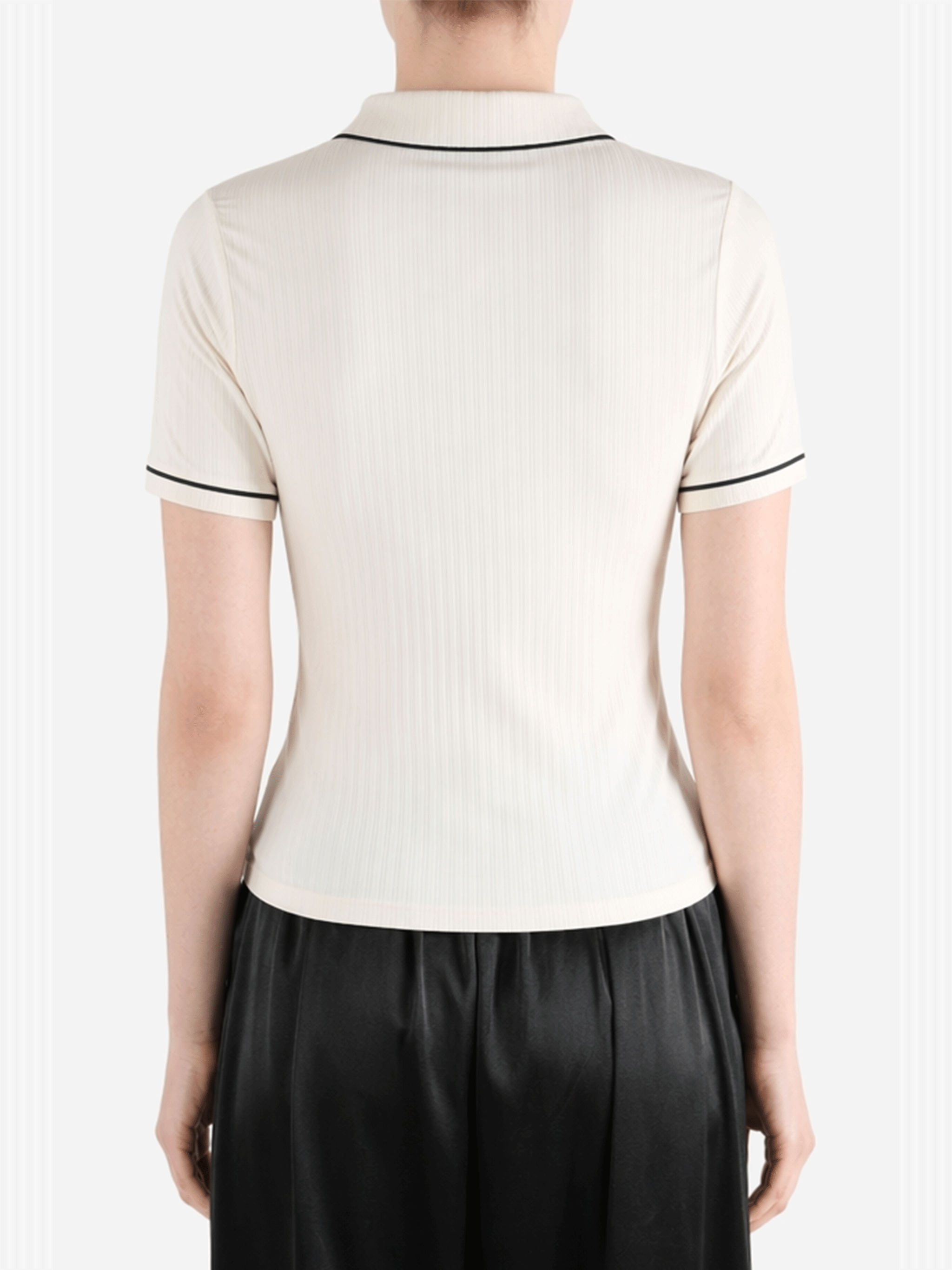 White t-shirt worn by a person, showing the t-shirt fit