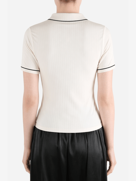 White t-shirt worn by a person, showing the t-shirt fit