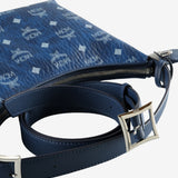 Close up of blue bag, showing texture of the leather fabric