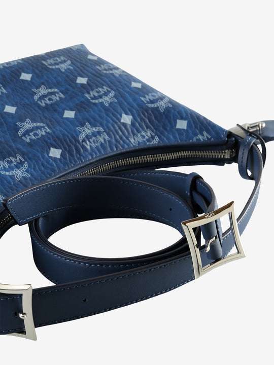 Close up of blue bag, showing texture of the leather fabric