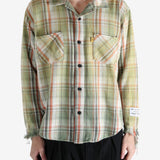 Green shirts worn by a person, showing the shirts's fit