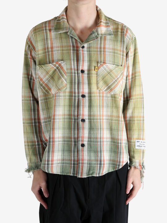 Green shirts worn by a person, showing the shirts's fit