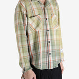 Green shirts worn by a person, showing the shirts's fit