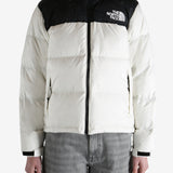 White jacket worn by a person, showing the jacket fit