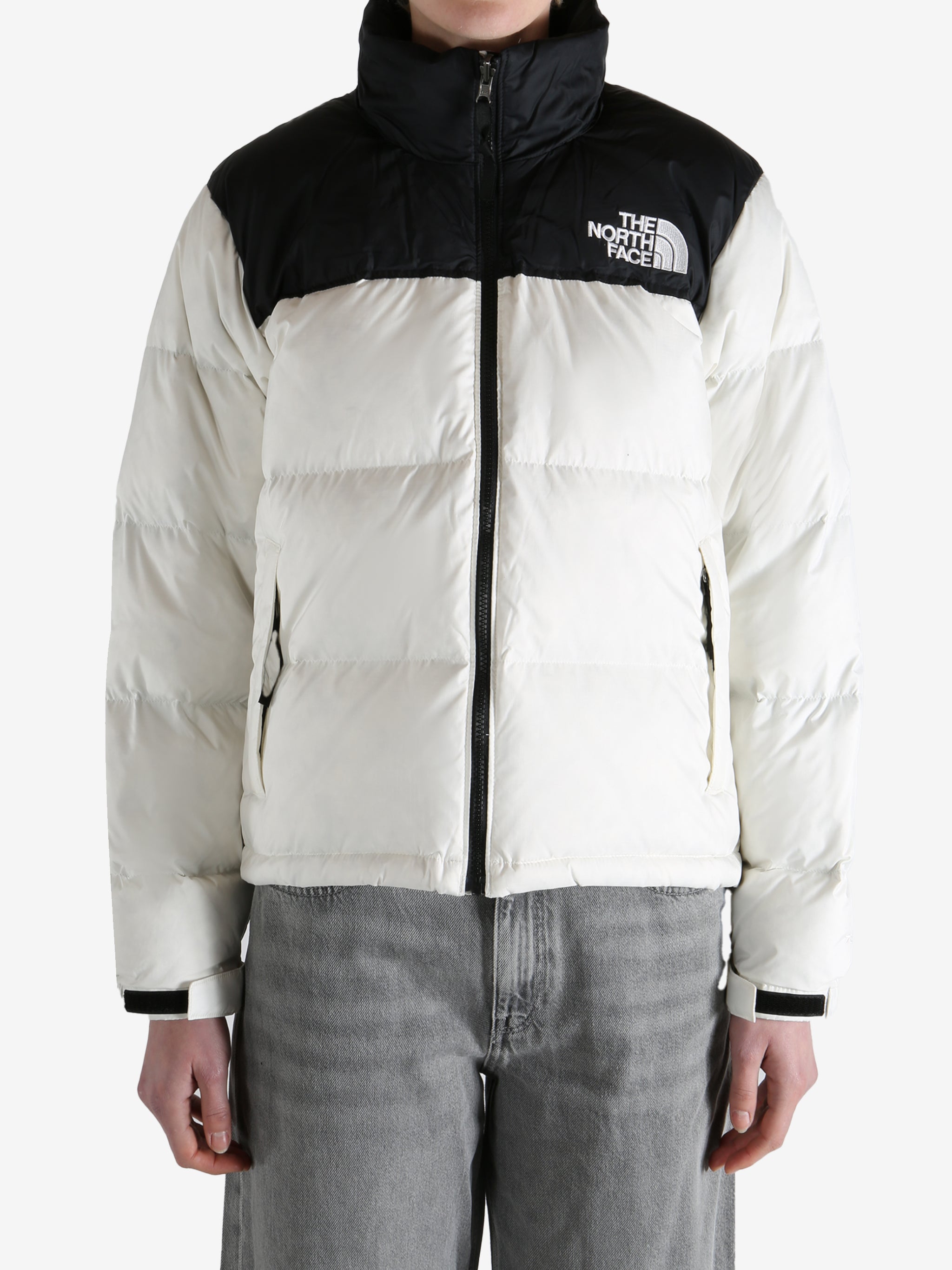 White jacket worn by a person, showing the jacket fit