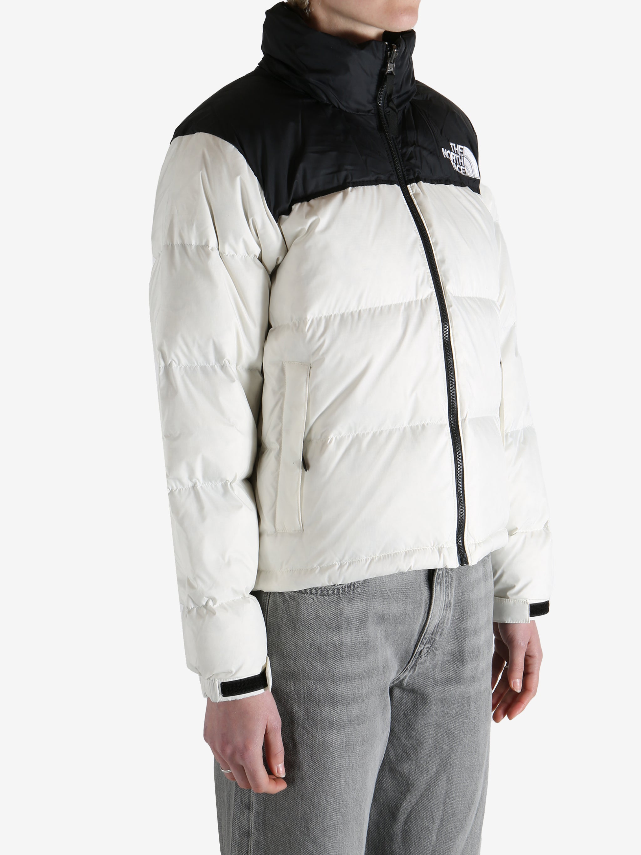 White jacket worn by a person, showing the jacket fit