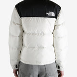 White jacket worn by a person, showing the jacket fit