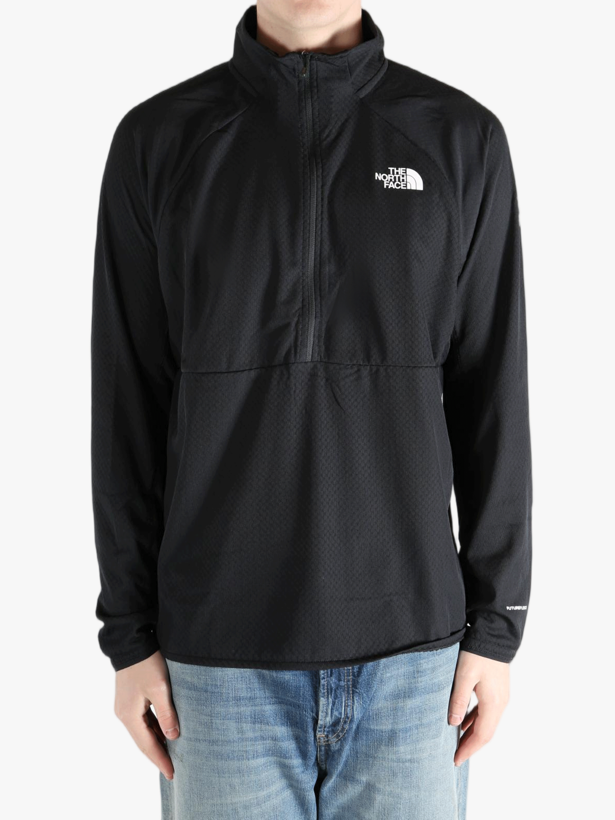 Black jacket worn by a person, showing the jacket fit