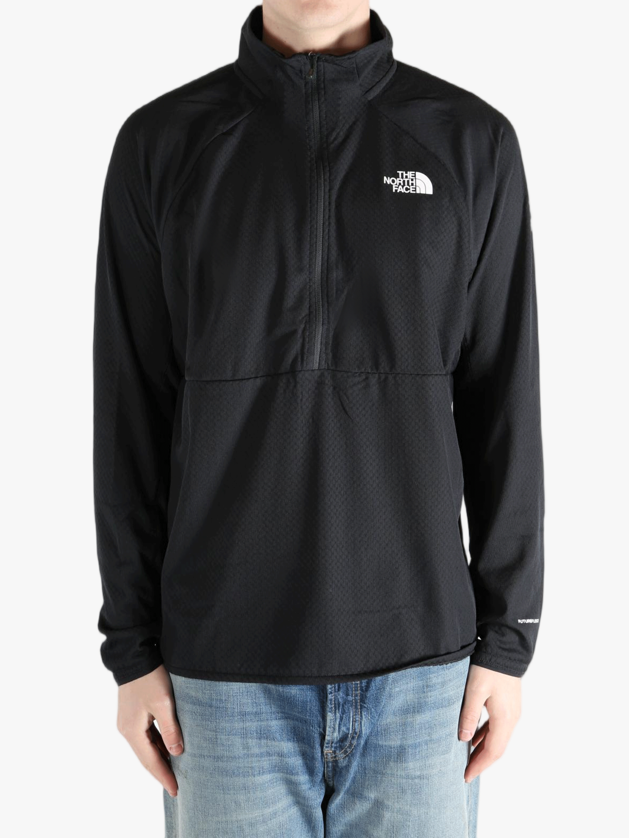 Black jacket worn by a person, showing the jacket fit