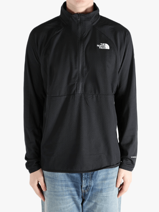 Black jacket worn by a person, showing the jacket fit