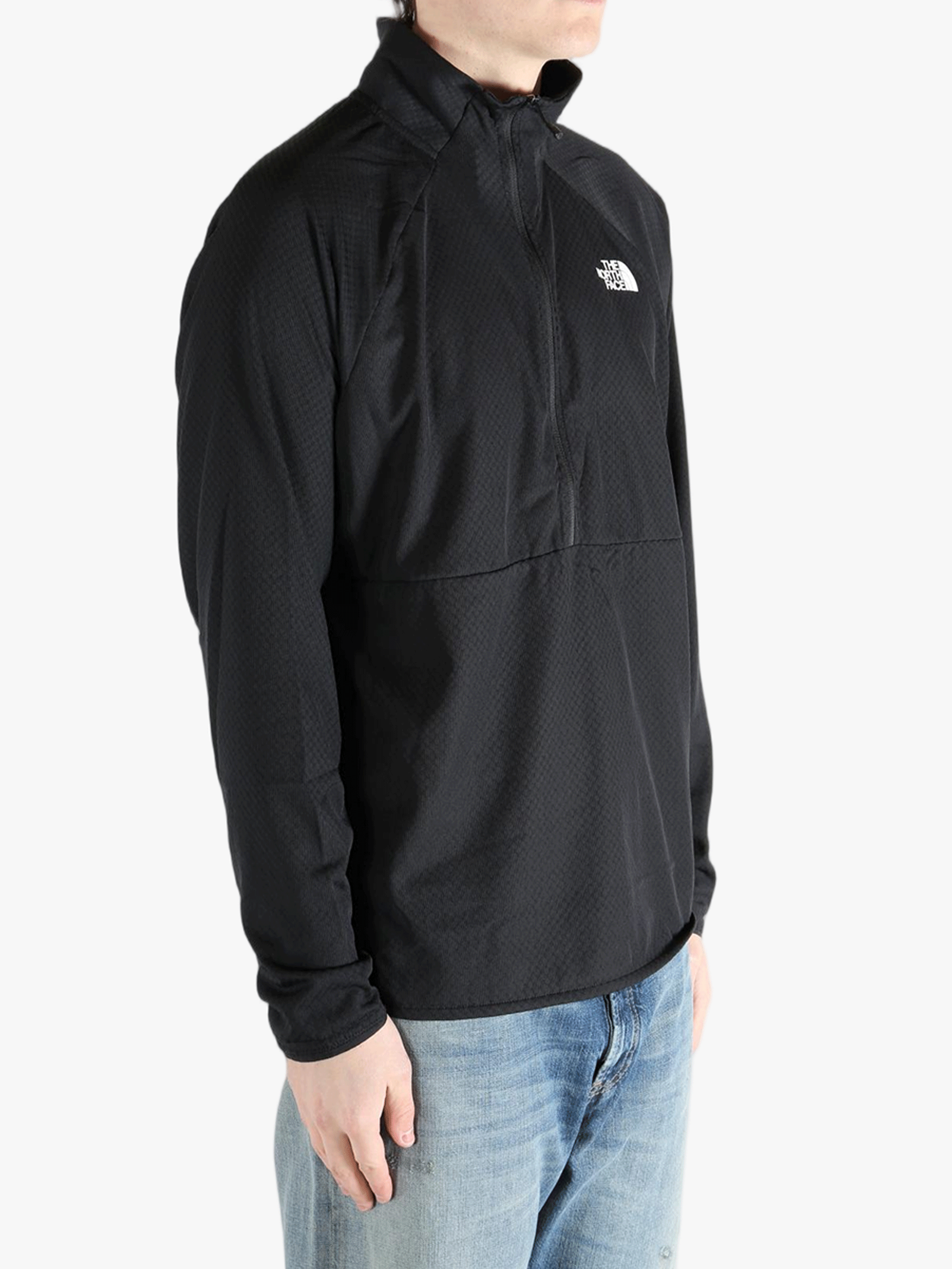 Black jacket worn by a person, showing the jacket fit