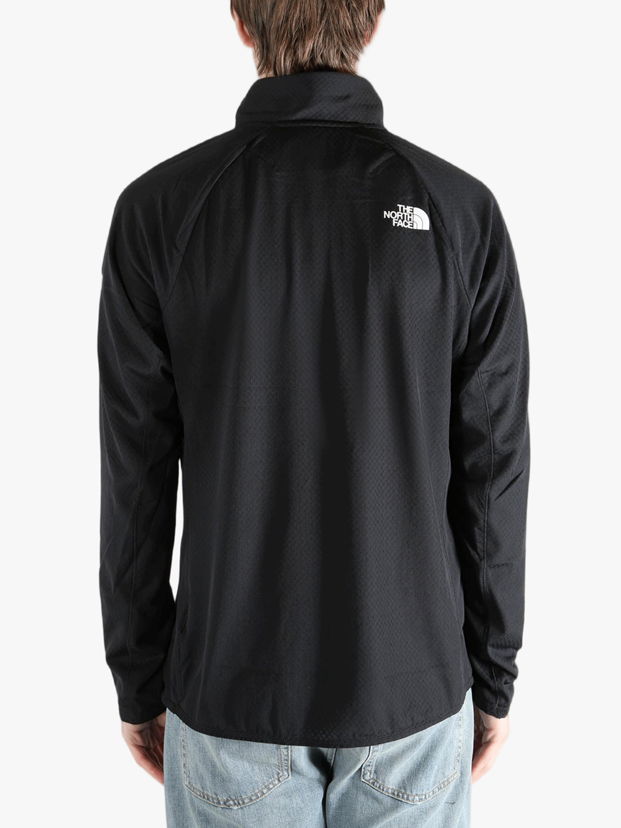 Black jacket worn by a person, showing the jacket fit