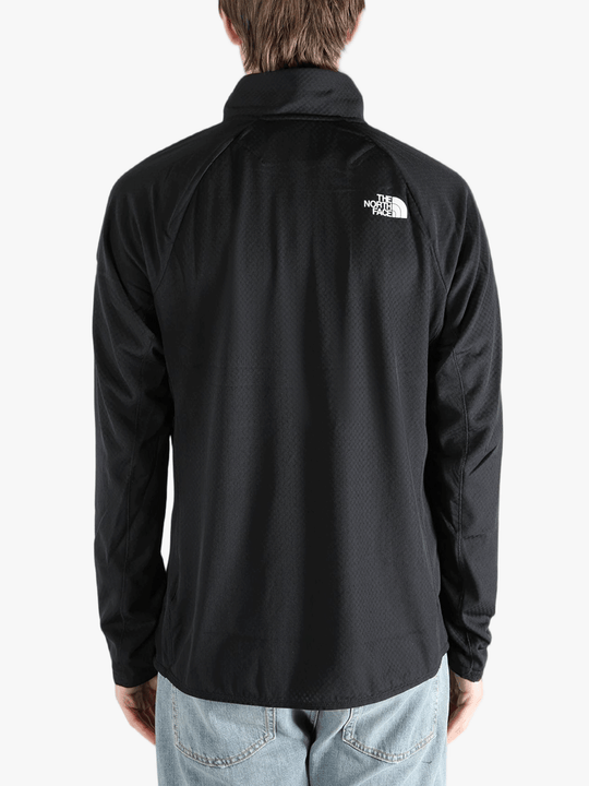 Black jacket worn by a person, showing the jacket fit