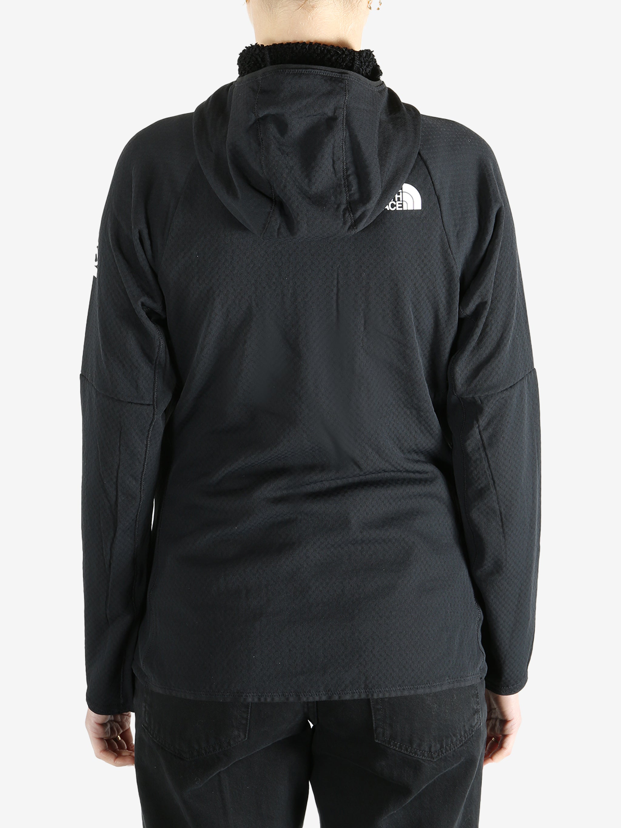 Black hoodies worn by a person, showing the hoodies fit