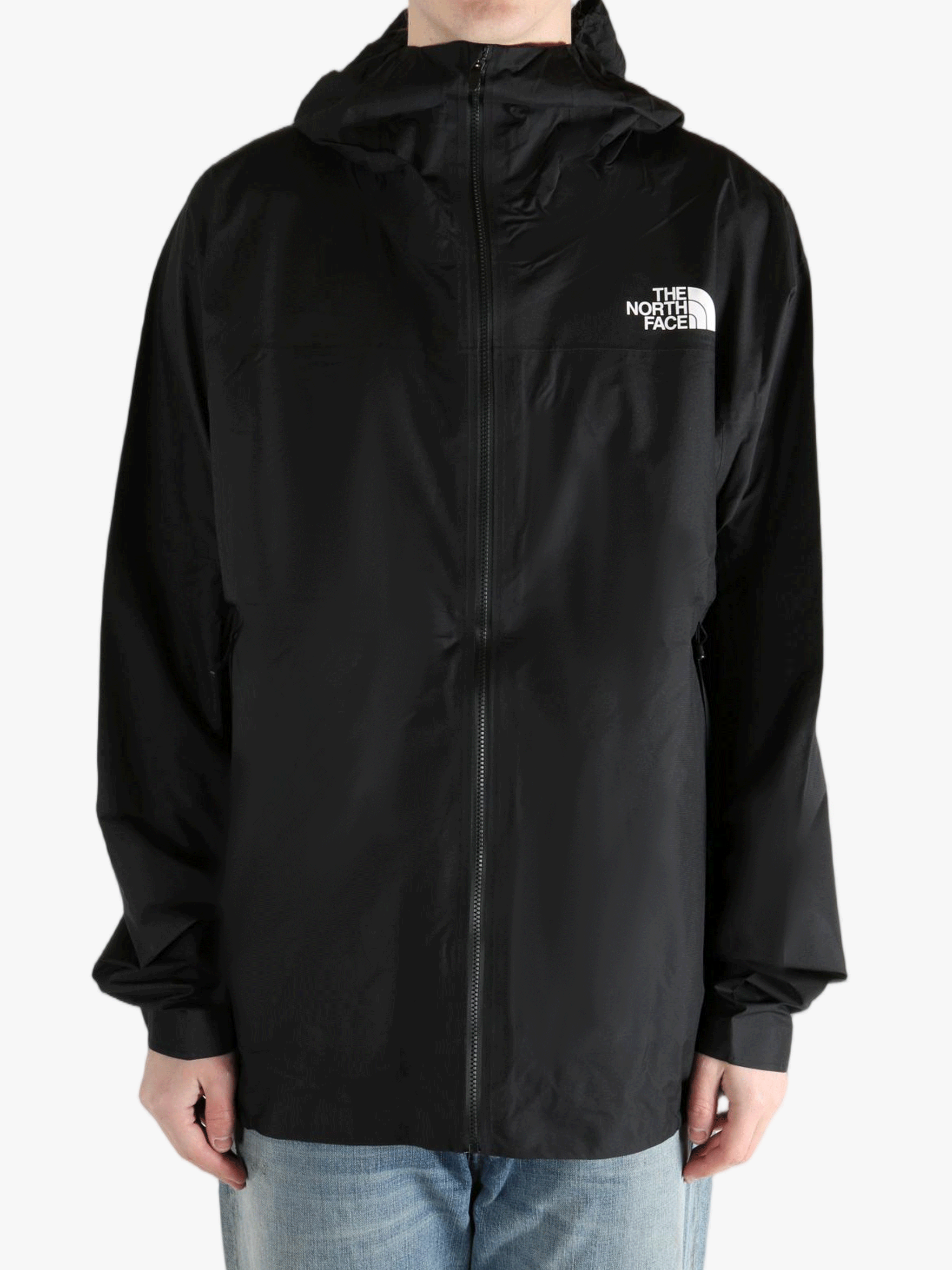 Black jacket worn by a person, showing the jacket fit