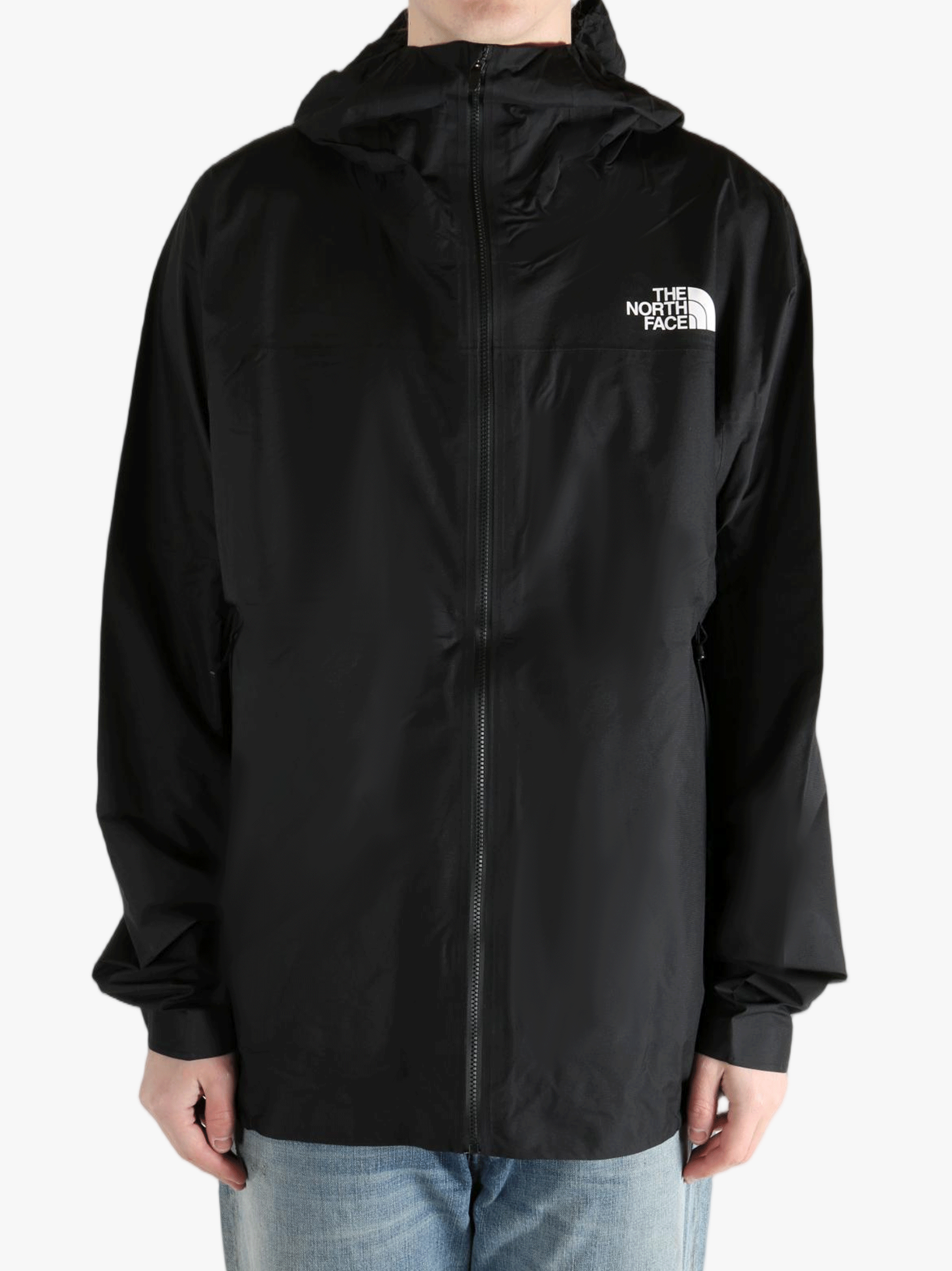 Black jacket worn by a person, showing the jacket fit