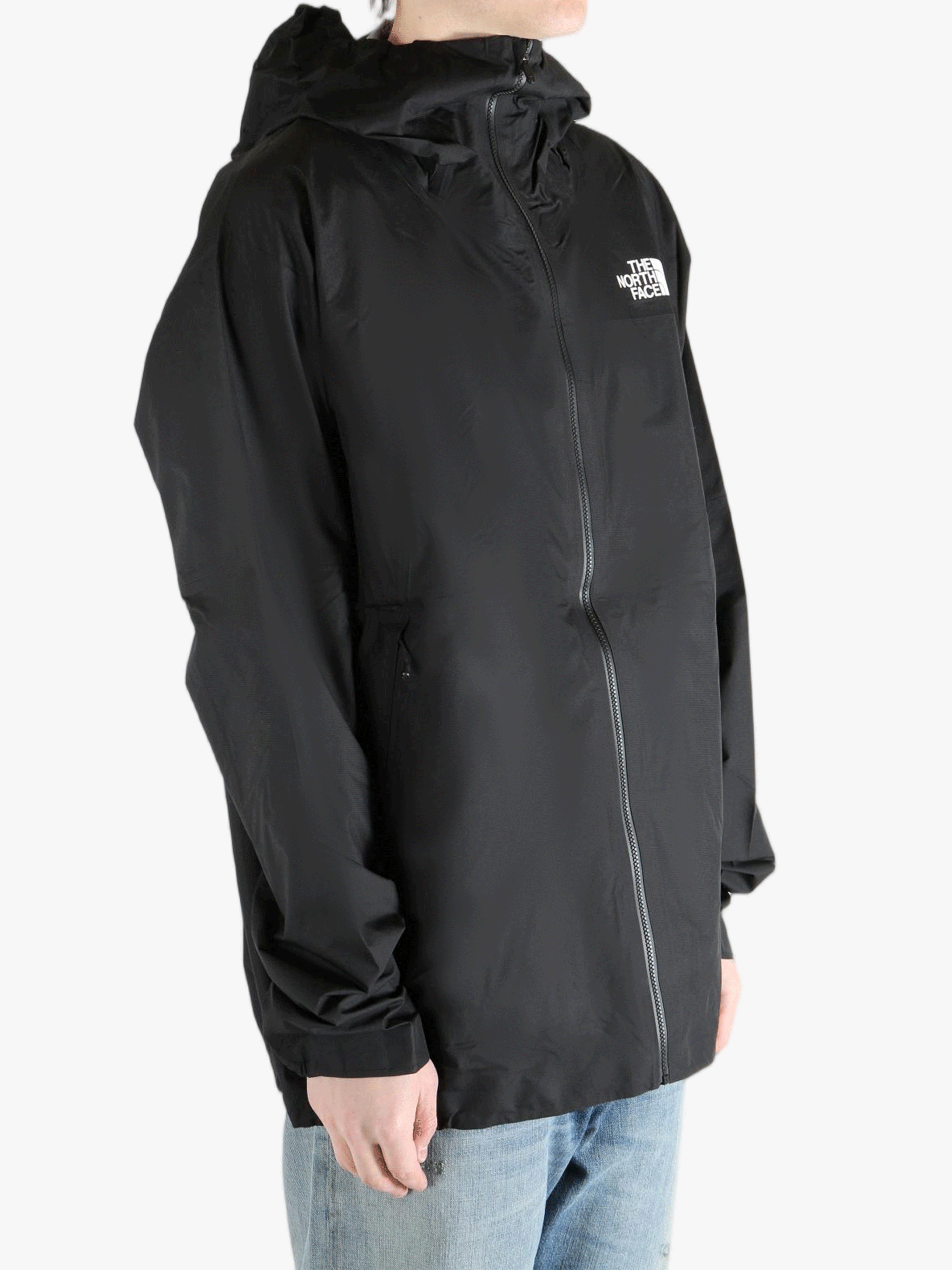 Black jacket worn by a person, showing the jacket fit