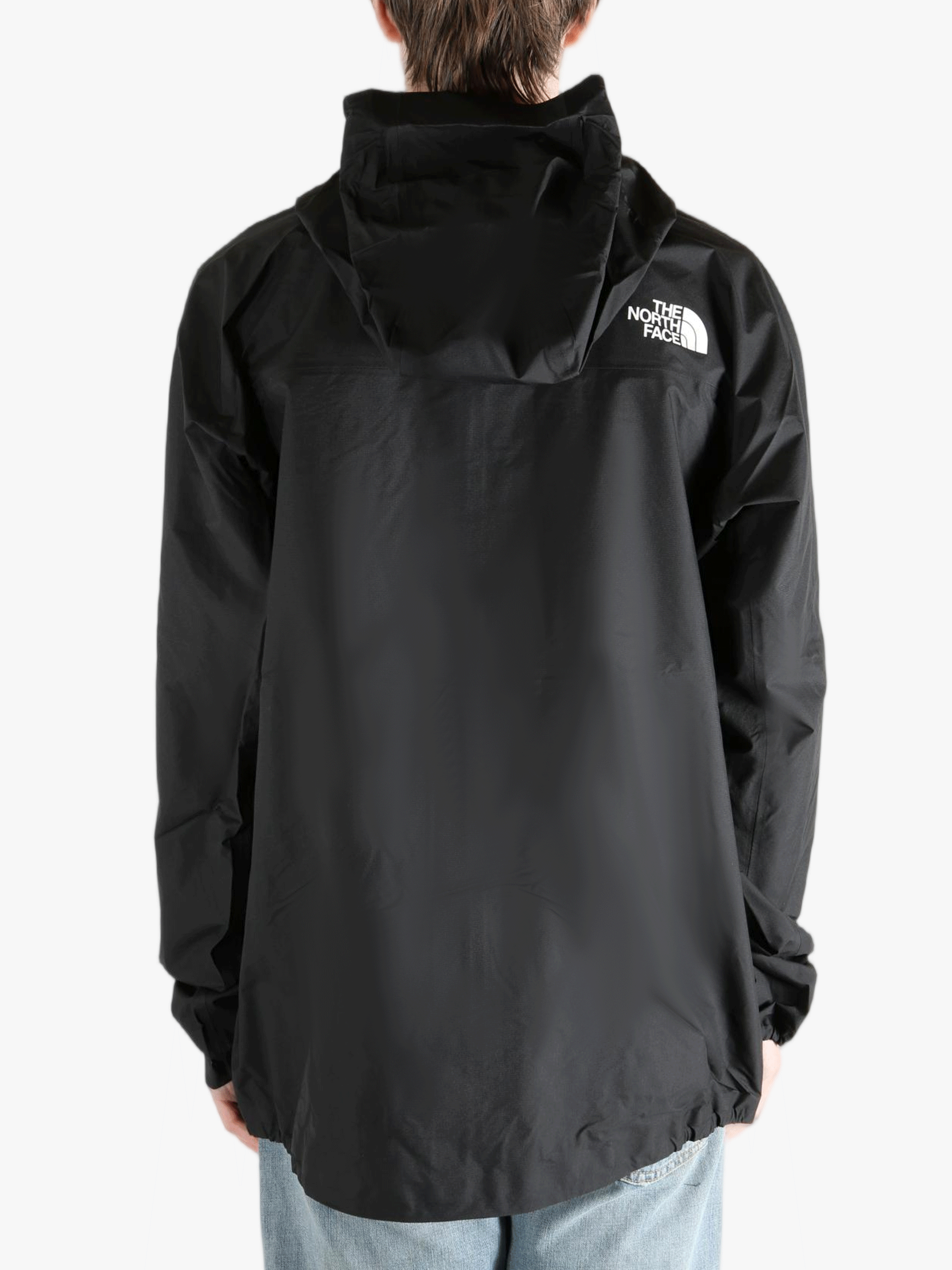 Black jacket worn by a person, showing the jacket fit