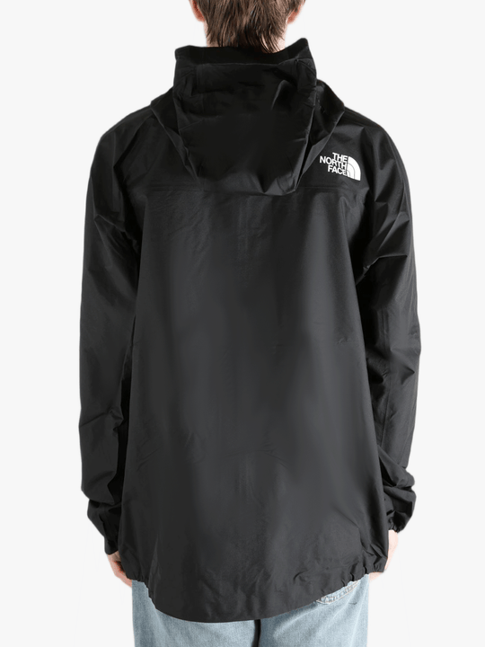 Black jacket worn by a person, showing the jacket fit