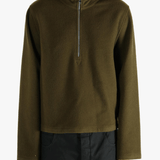 Brown sweater worn by a person, showing the sweater fit