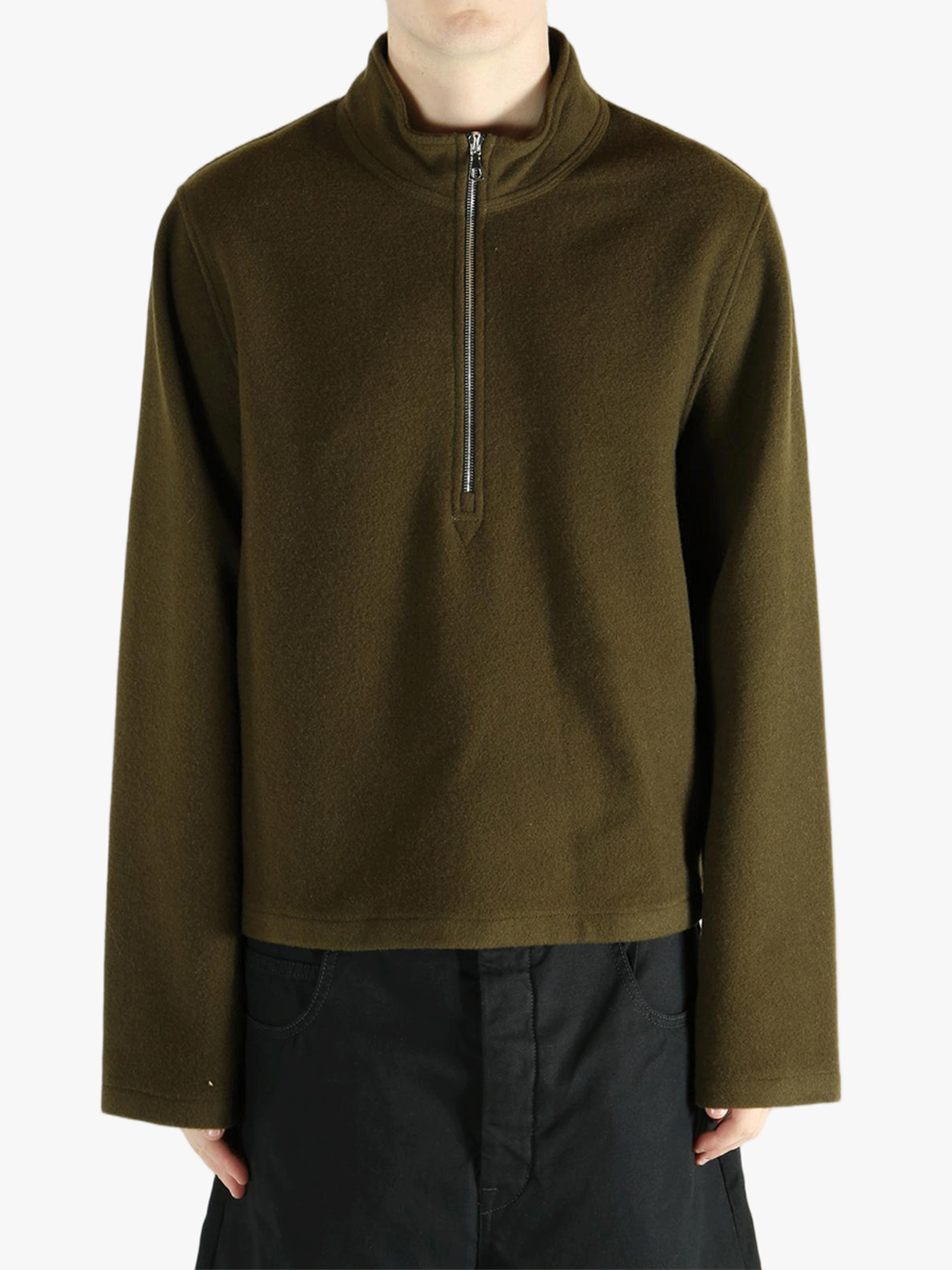 Brown sweater worn by a person, showing the sweater fit